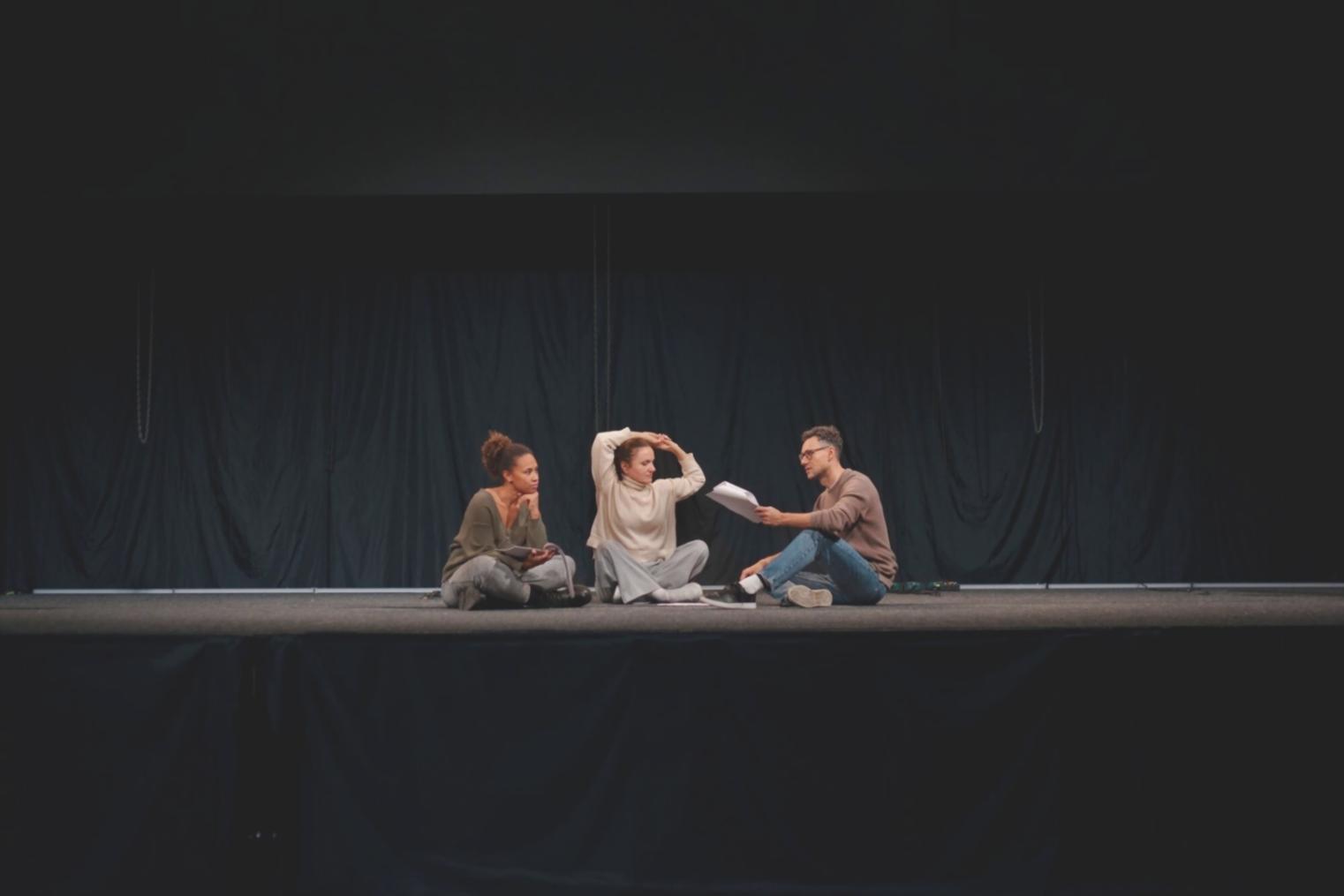 Acting workshop with students practicing emotional expression techniques in a studio setting